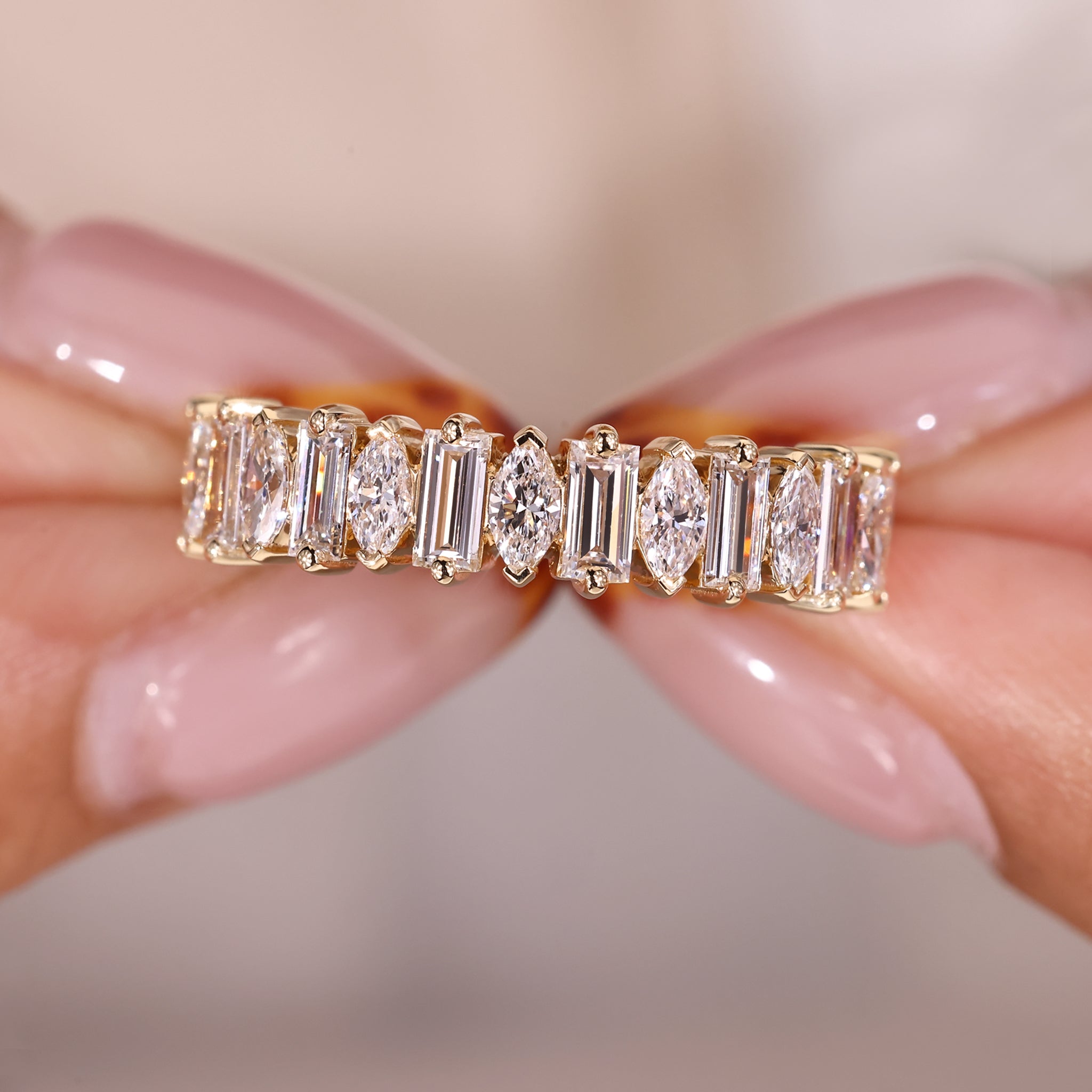 Half eternity band with marquise and baguette diamonds.