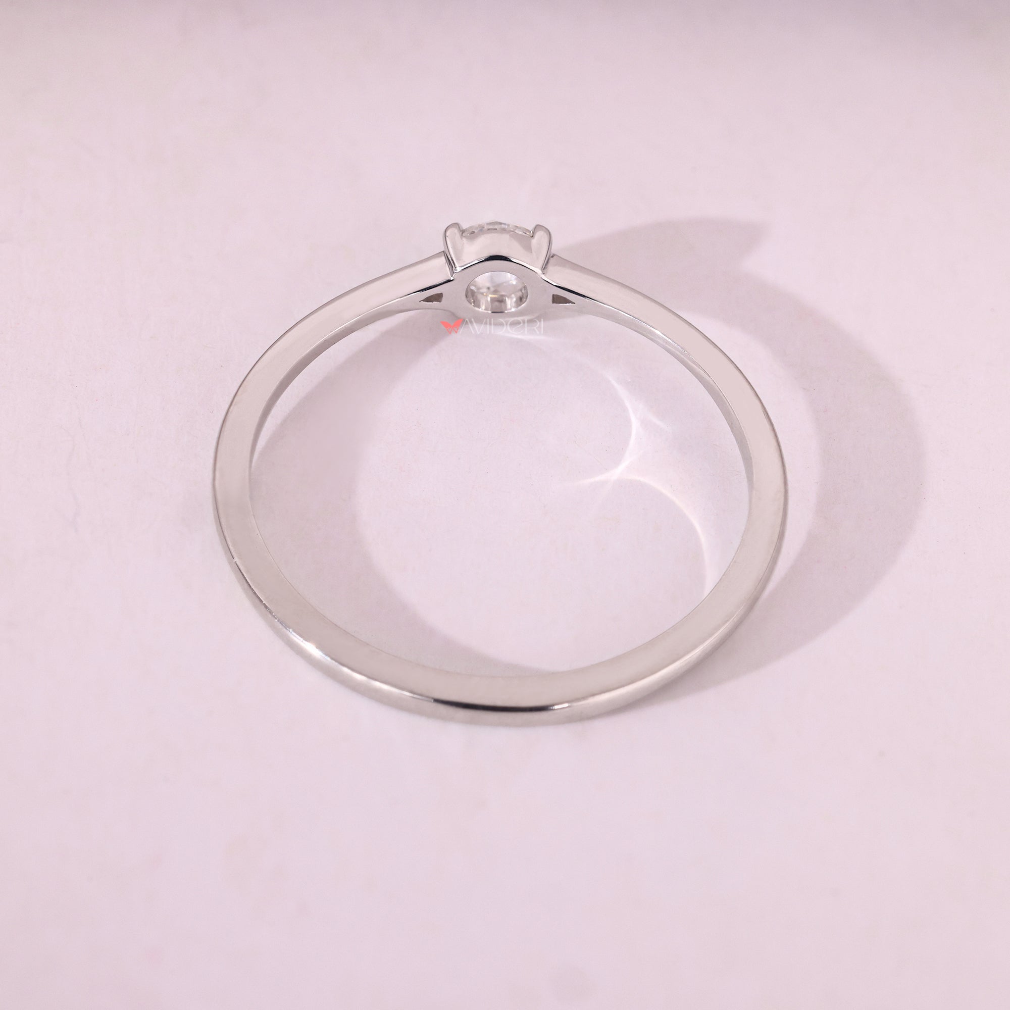 Handmade jewelry in tapered shank ring.