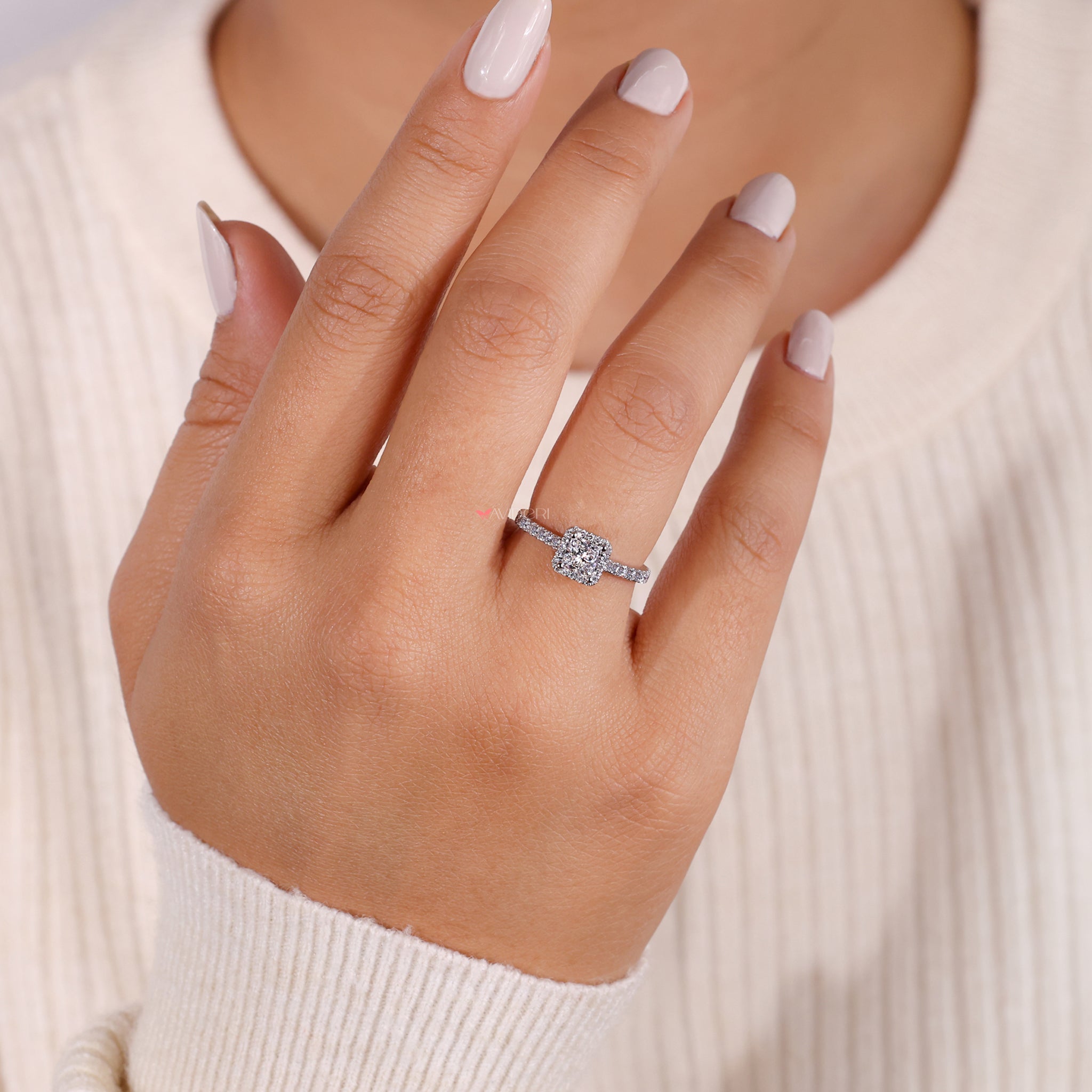 Handmade jewelry with a princess cut diamond in an avidieri ring, crafted with care for a truly unique and luxurious design.