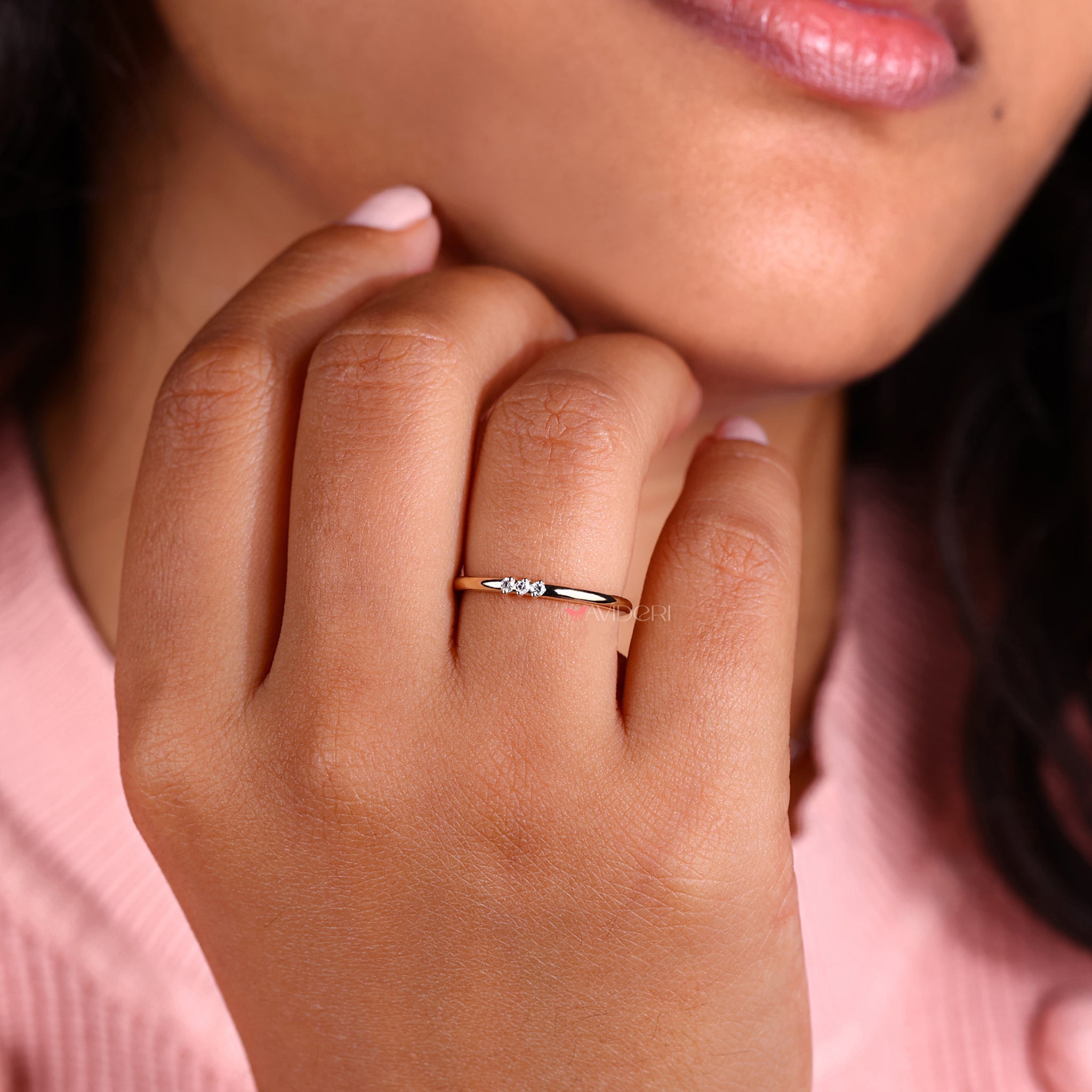 Prong set diamond band featuring brilliant round diamonds.