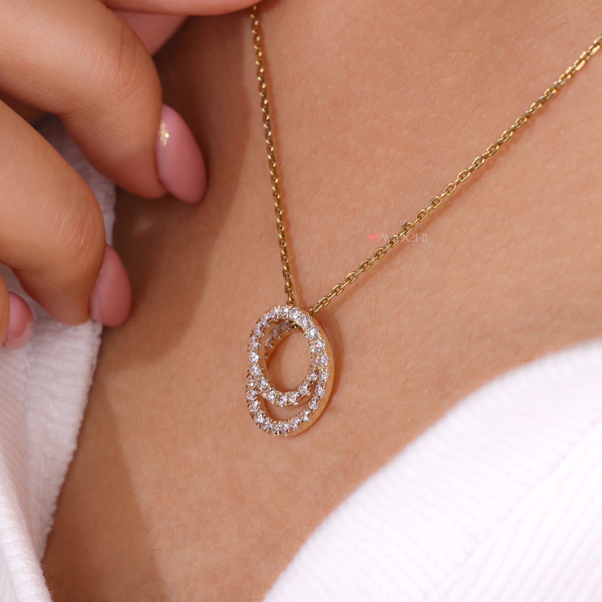 Twisted pendant with a round diamond pendant for a modern touch.