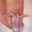 Wave-shaped band with round diamonds, designed for a smooth and flowing look.