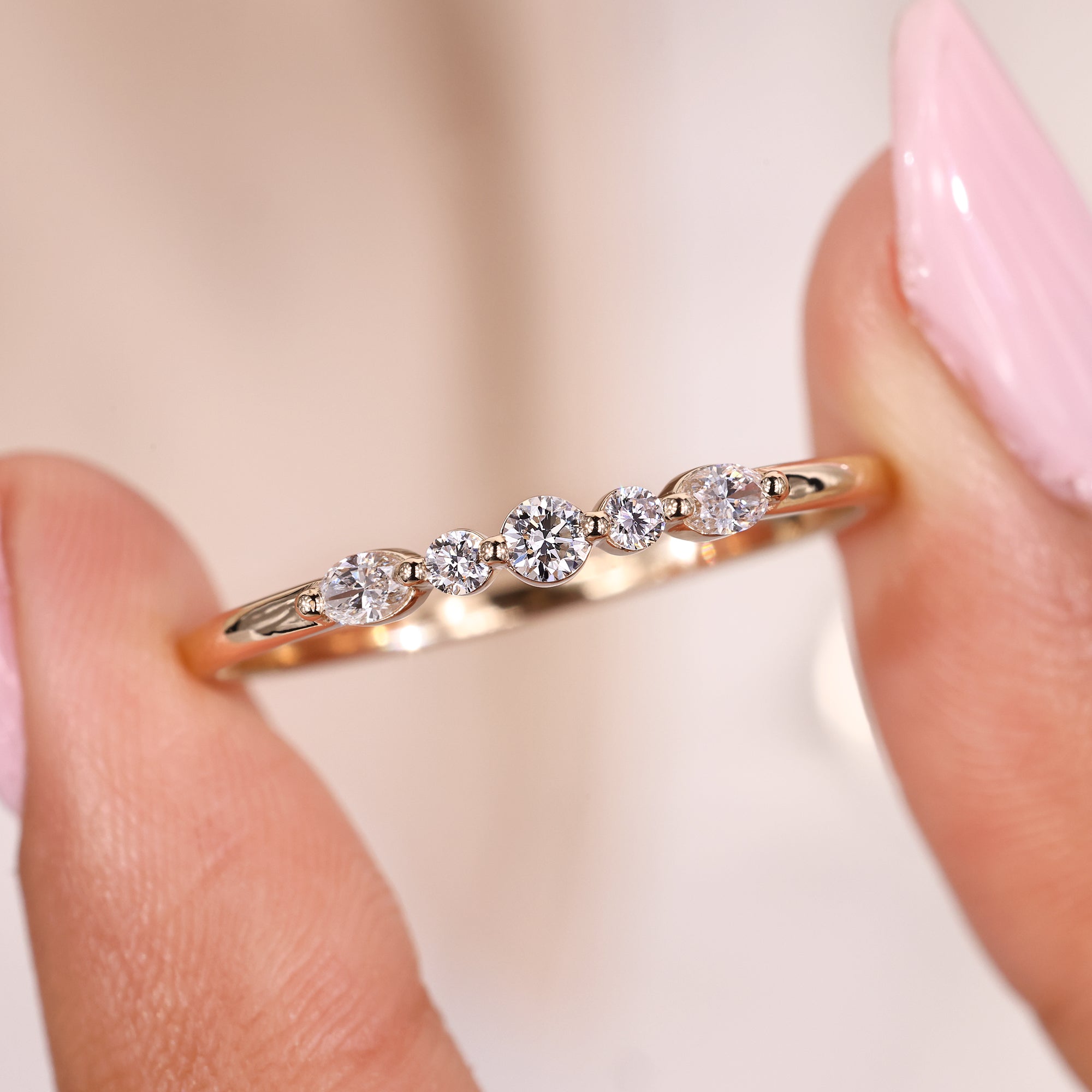 Shared prong wedding band with oval diamond band.