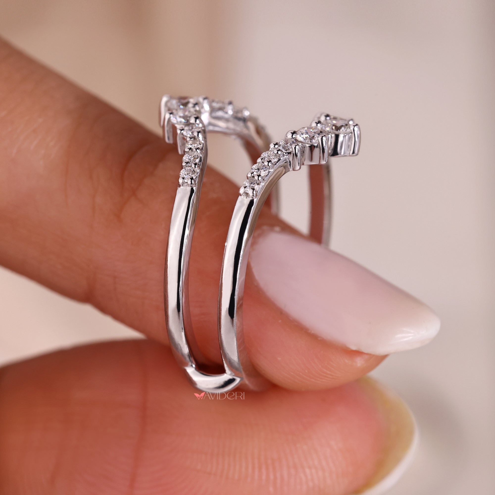 White gold guard wrap wedding band with round cut diamonds.