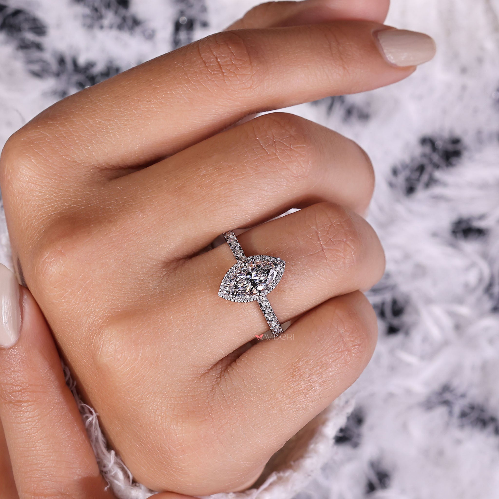 Timeless beauty in pavé diamonds paired with a sleek and elegant marquise setting for a stunning engagement ring.