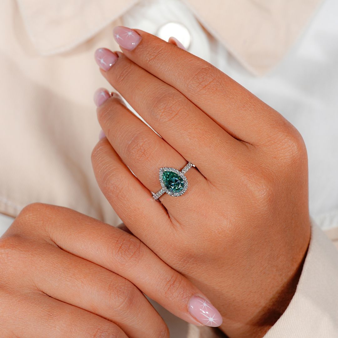 Halo ring with a pear shaped diamond for added sparkle.