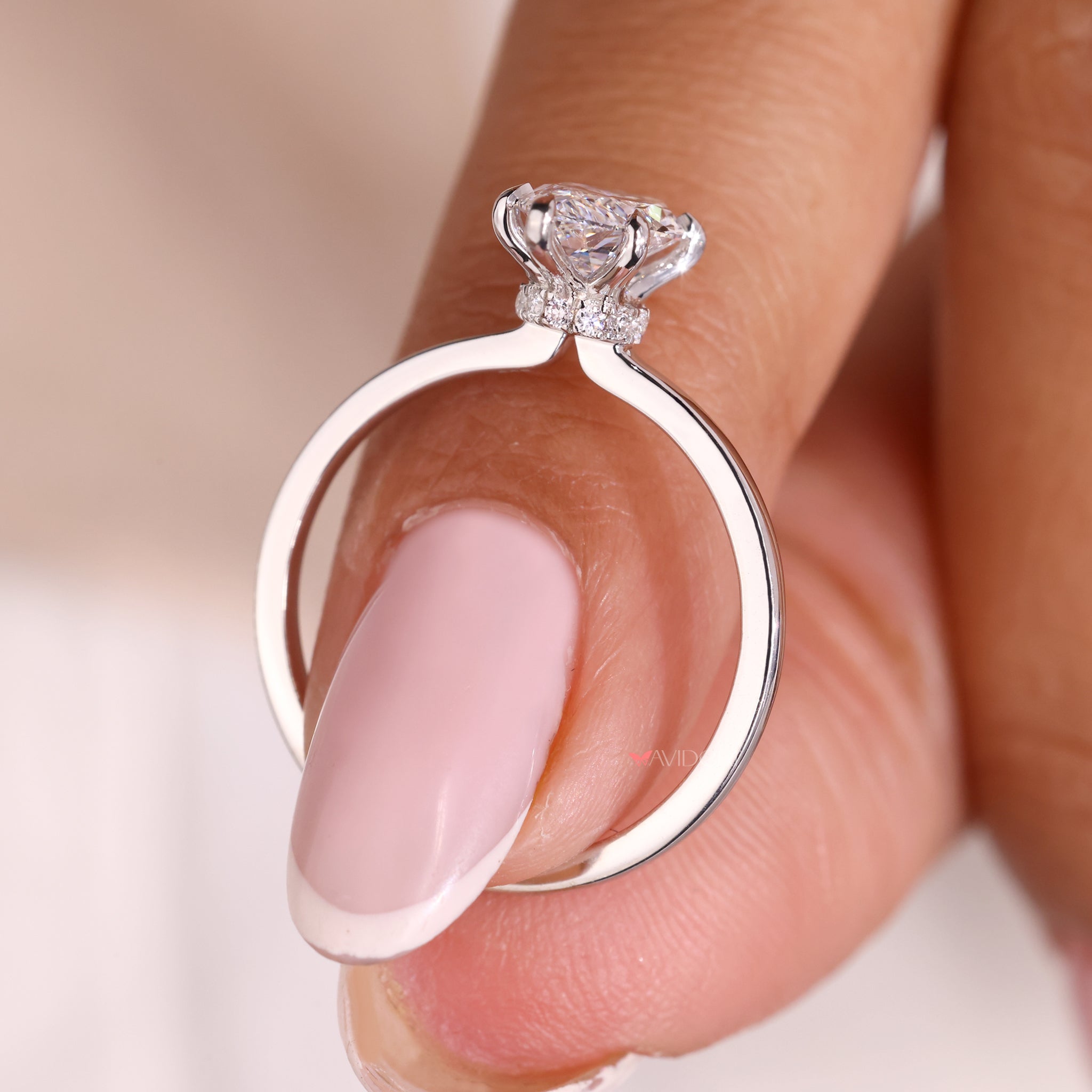 Marquise cut diamond ring with a hidden halo setting.