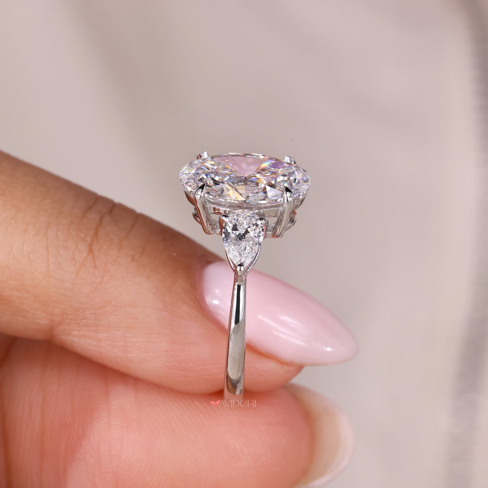 Three Stone Oval Engagement Ring – Pear Side Stones