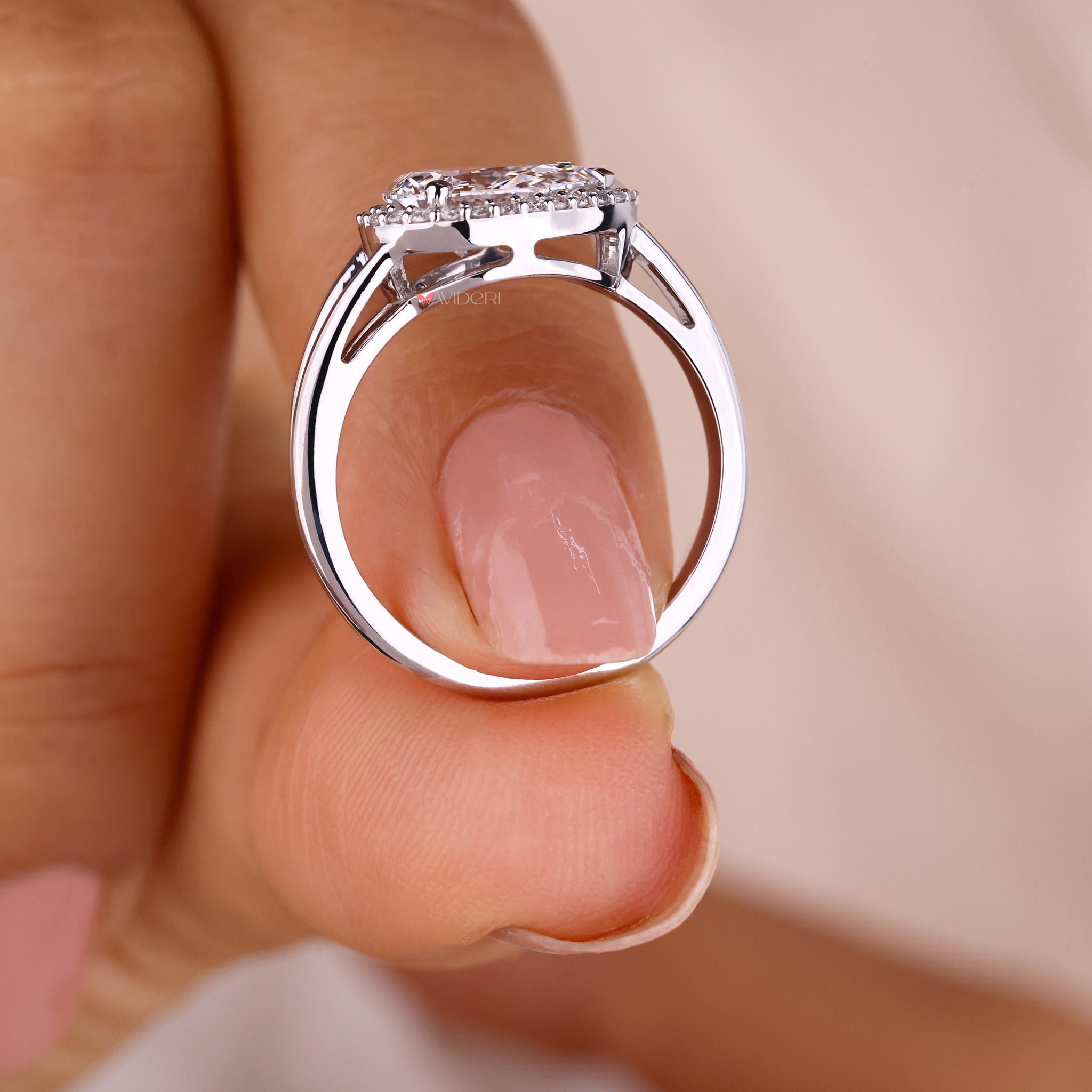 white Gold Pear diamond ring with a halo diamond ring.