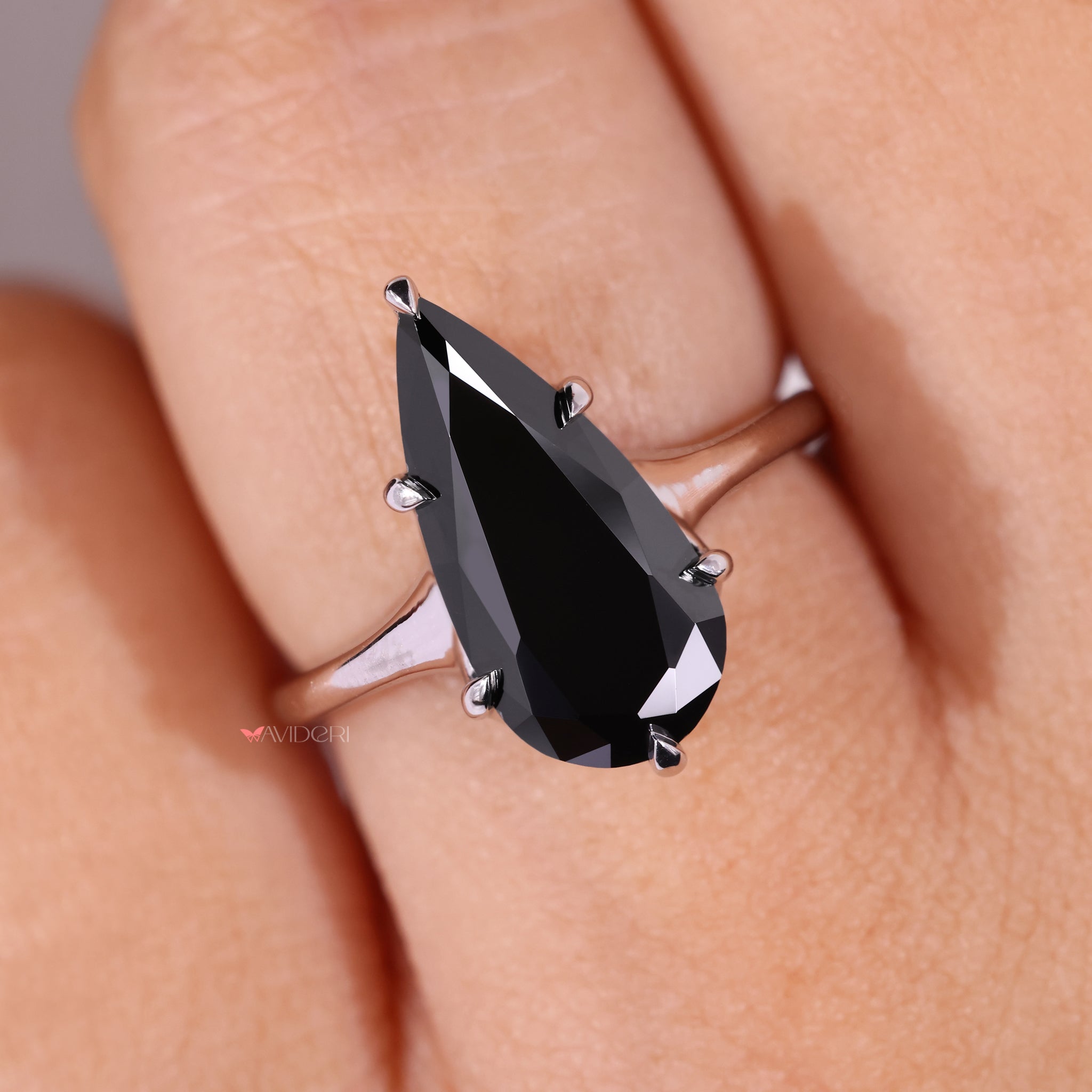 Black Diamond Ring with a striking pear-cut stone.