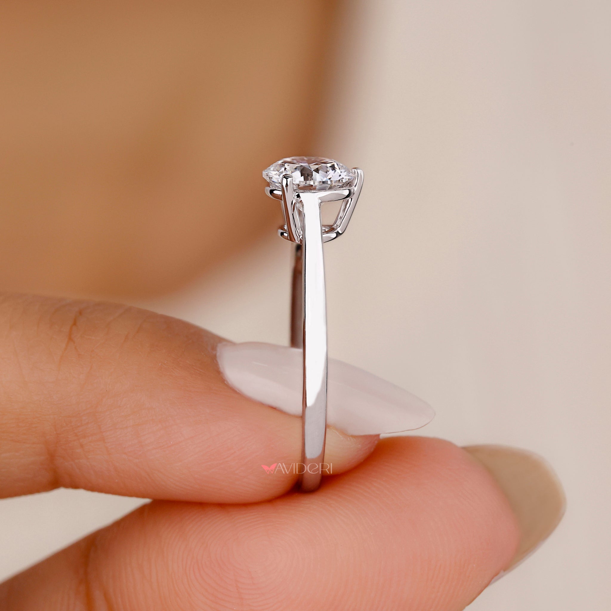 Round solitaire engagement ring showcasing a dazzling round diamond, ideal for engagements and romantic milestones.