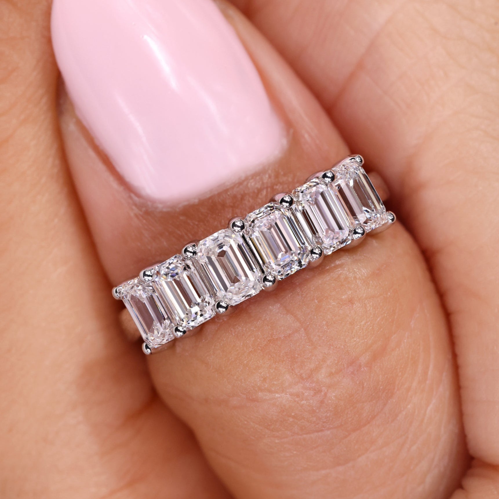 Emerald diamond wedding band with six lab grown diamonds.