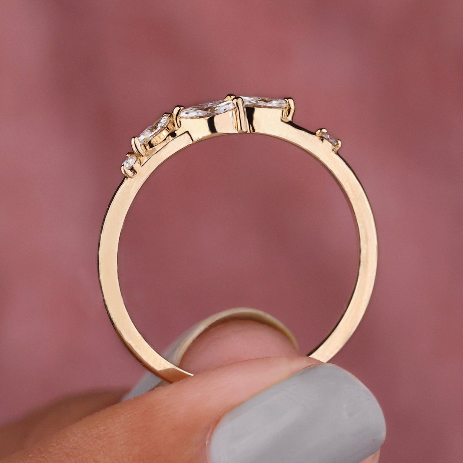 Marquise diamond wedding band with sleek design.