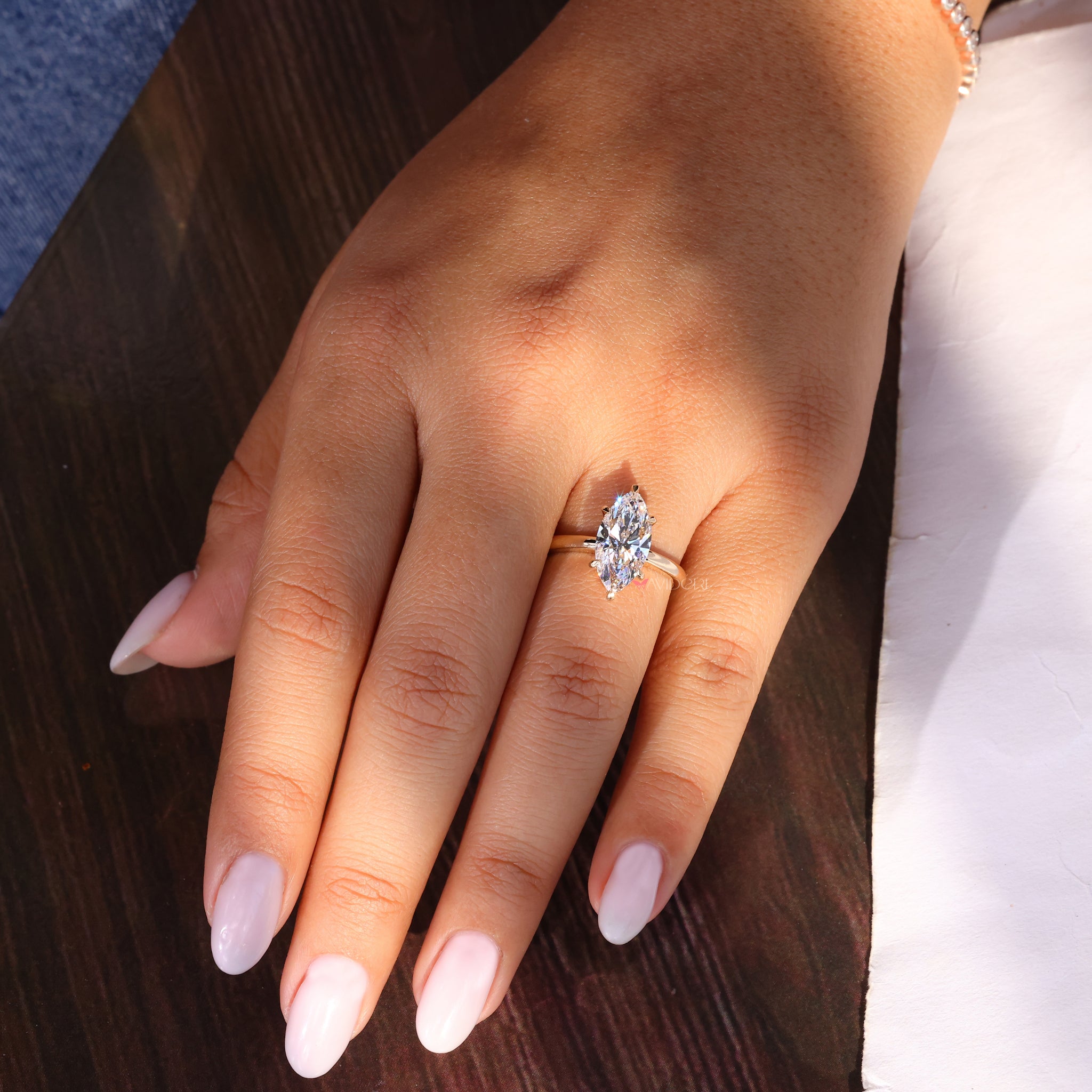 Solitaire engagement ring with a Marquise diamond for elegance.