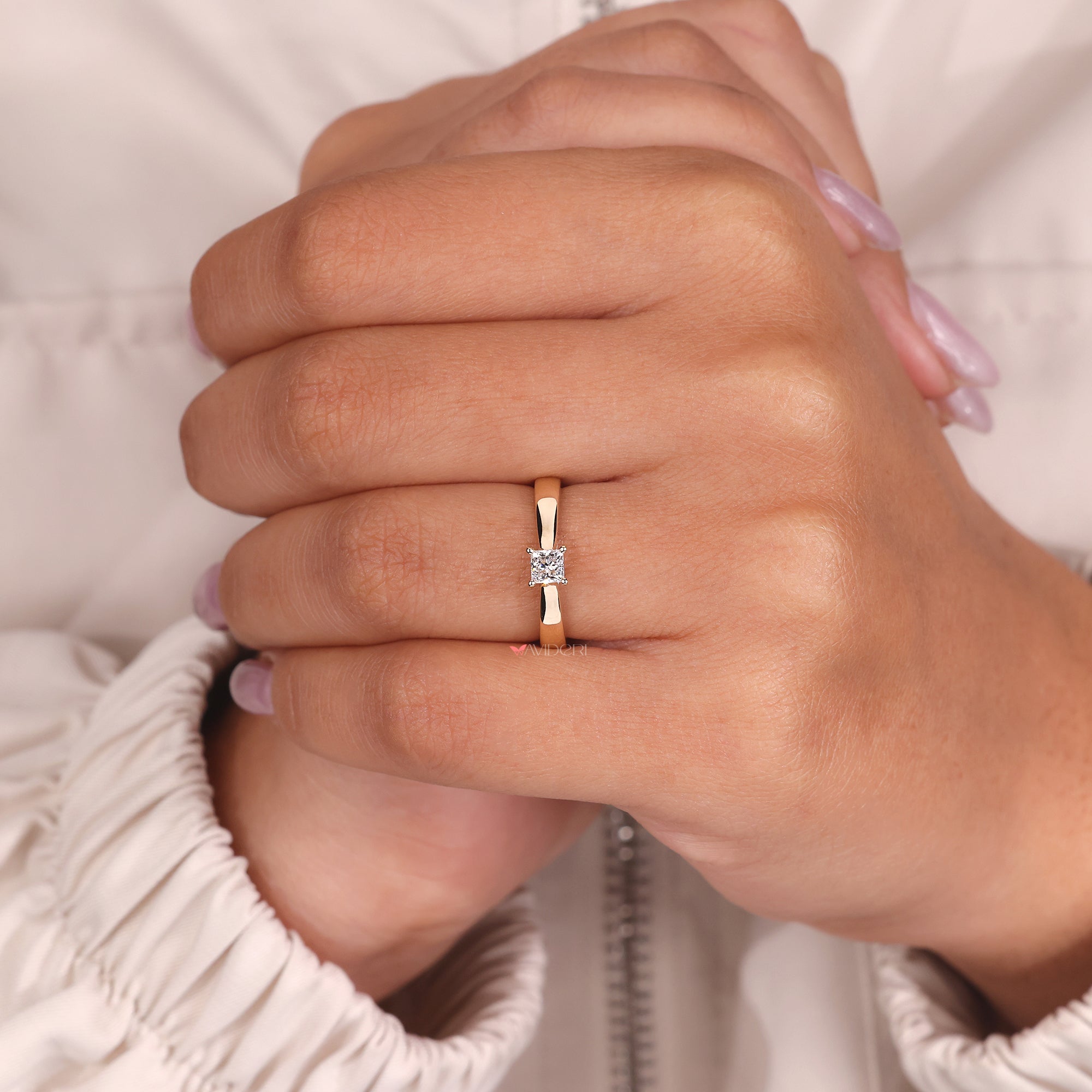 Custom engagement ring with a princess diamond, made to suit her personal style.