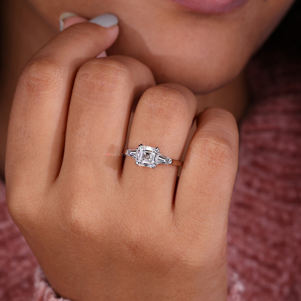 Three stone diamond ring designed with Lab Grown Diamond and tapered baguette engagement ring elements for brilliance.
