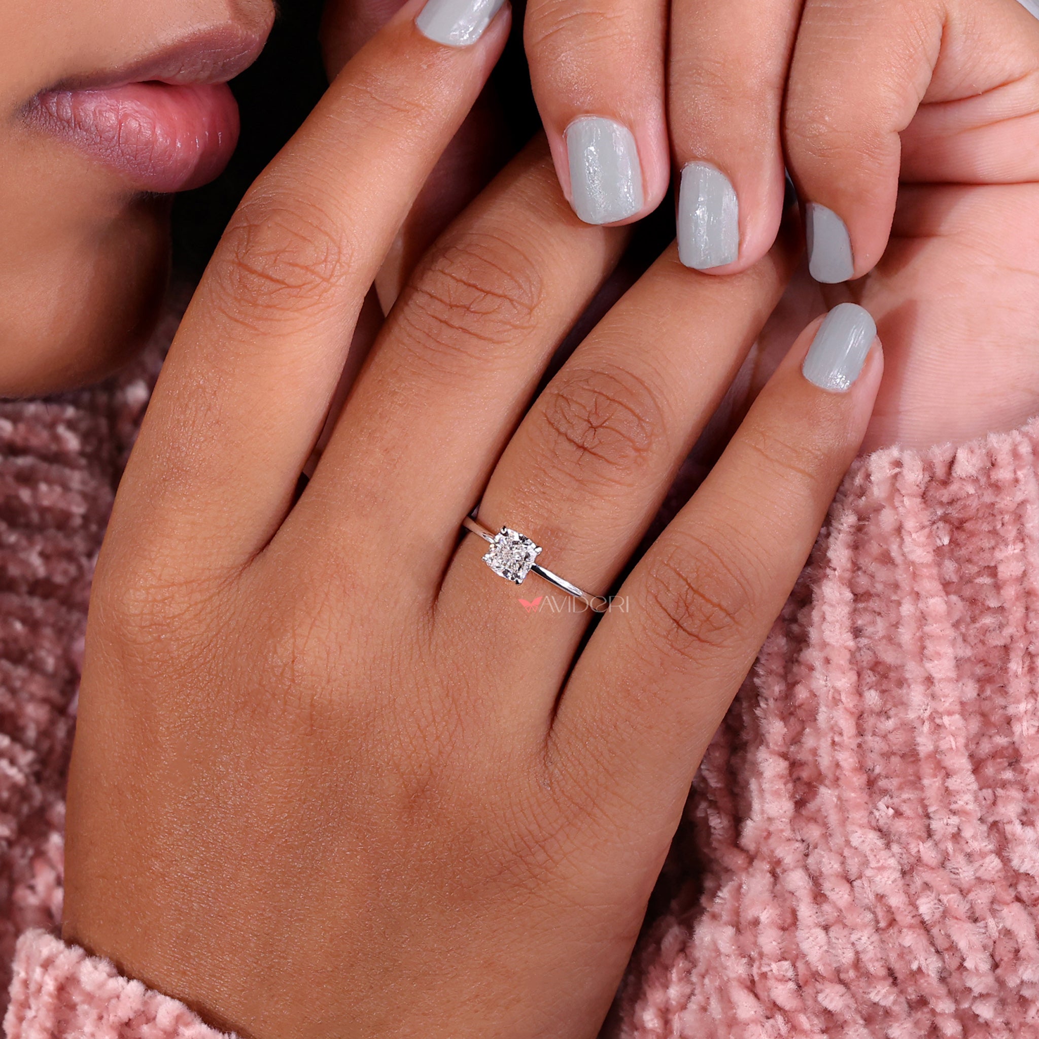 Solitaire cushion cut engagement ring with igi certified diamond and elegant design.
