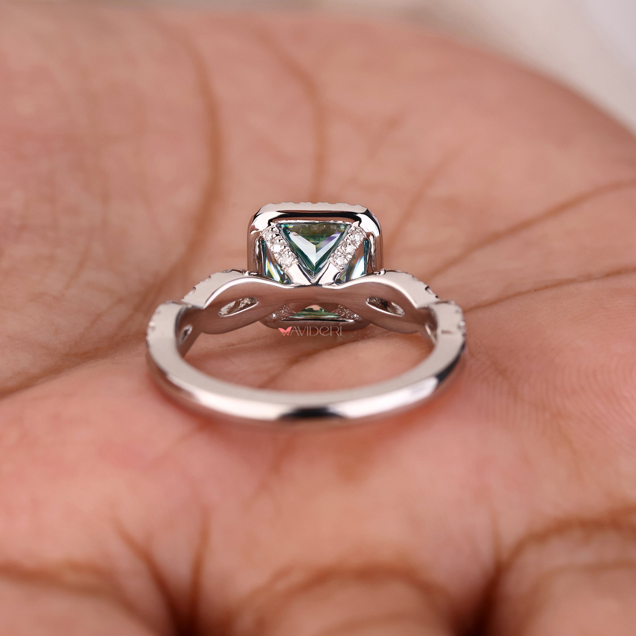 Twisted pave halo engagement ring for a modern and stylish look.
