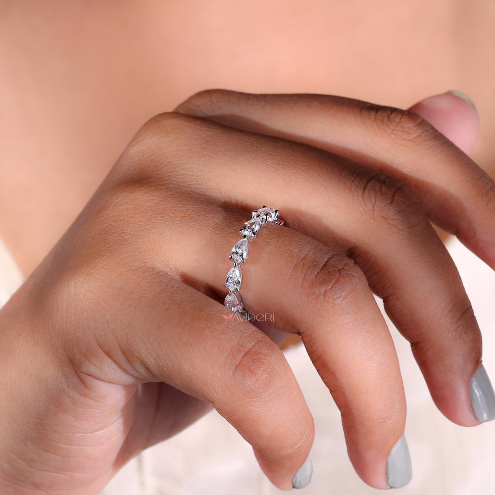 Prong setting band showcasing each diamond beautifully.
