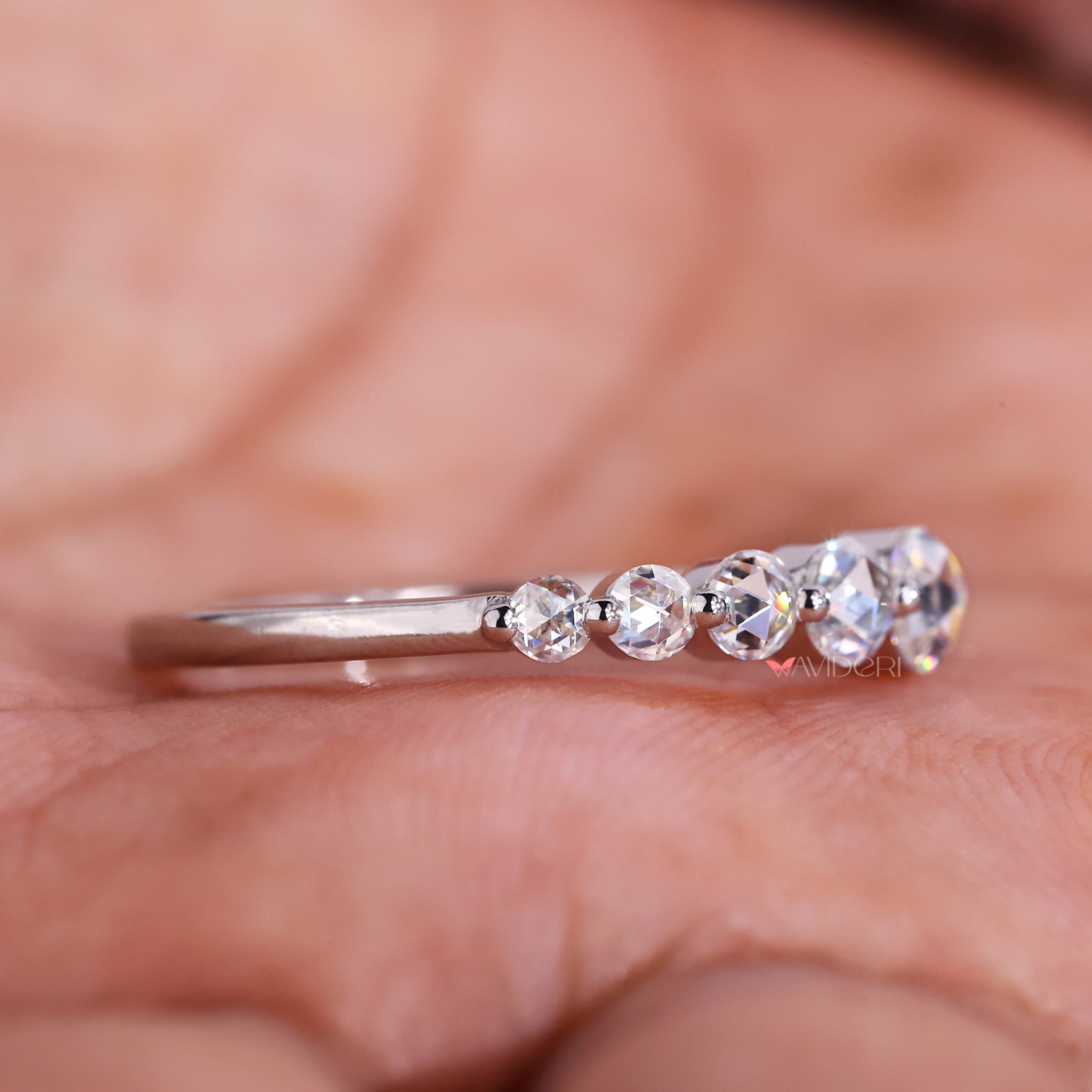 Round diamond wedding band adds a classic touch.
