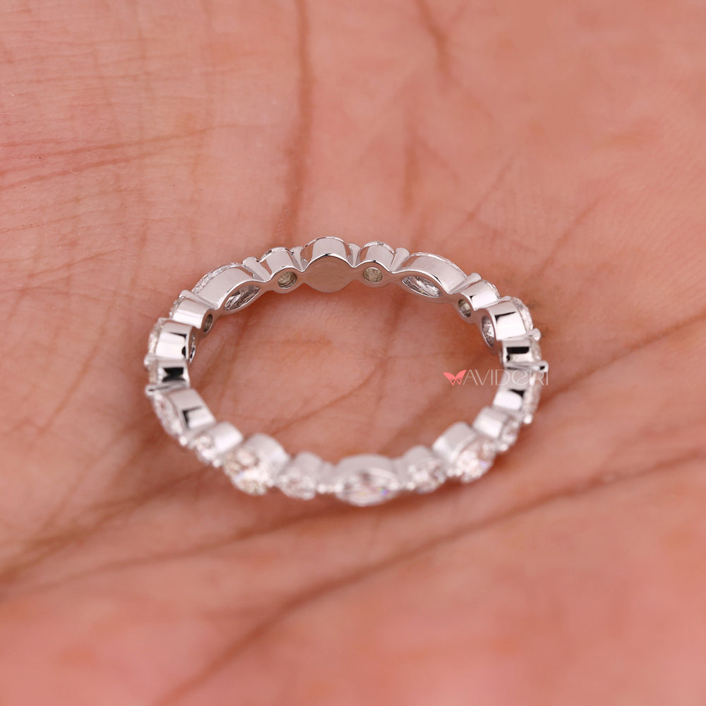 Shared prong wedding band showcasing delicate diamonds.
