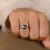 Halo ring setting with a round rose cut moissanite engagement ring.