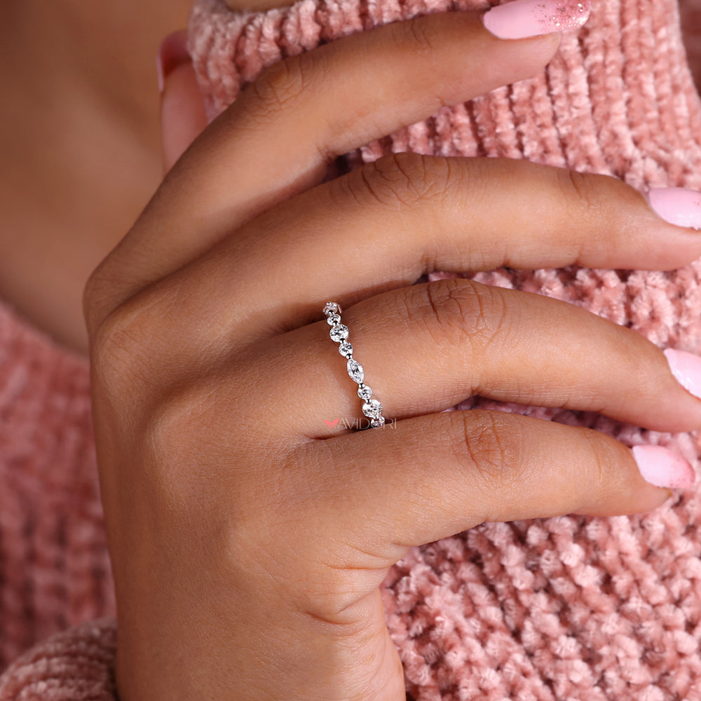 Shared prong eternity band for continuous sparkle.

