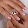 Shine with elegance wearing a solitaire ring set in a clean, minimal band.
