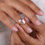 Shine with elegance wearing a solitaire ring set in a clean, minimal band.
