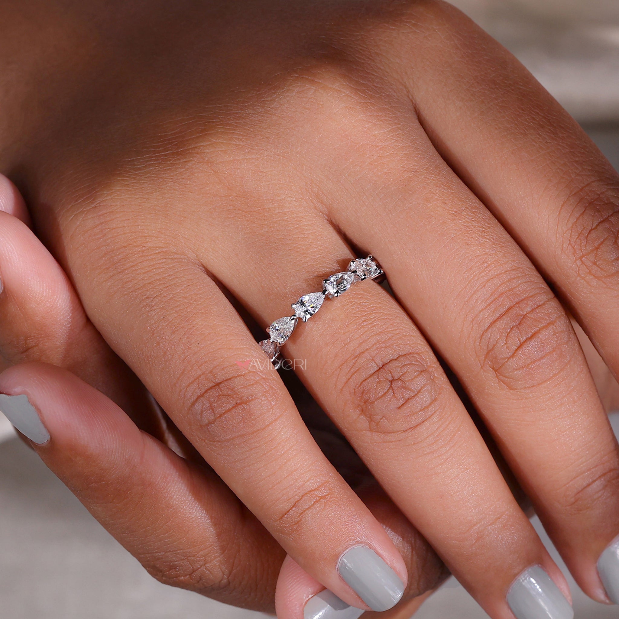Pear-shaped diamond wedding band with a modern twist.
