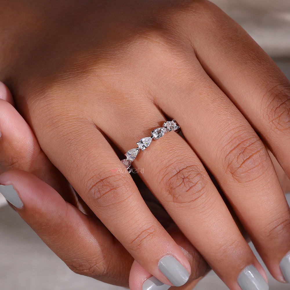 Pear-shaped diamond wedding band with a modern twist.
