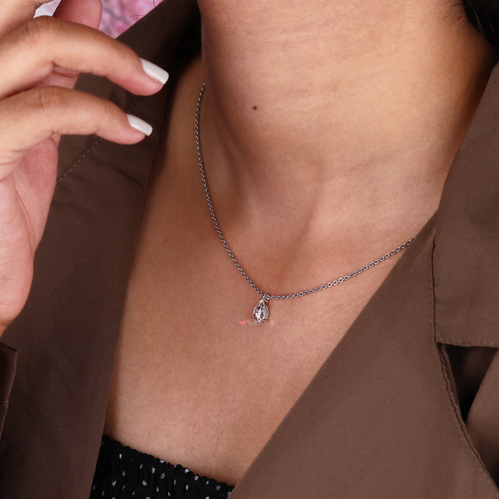 Three-prong pendant setting that highlights the beauty of the pear-shaped gemstone in a delicate design.