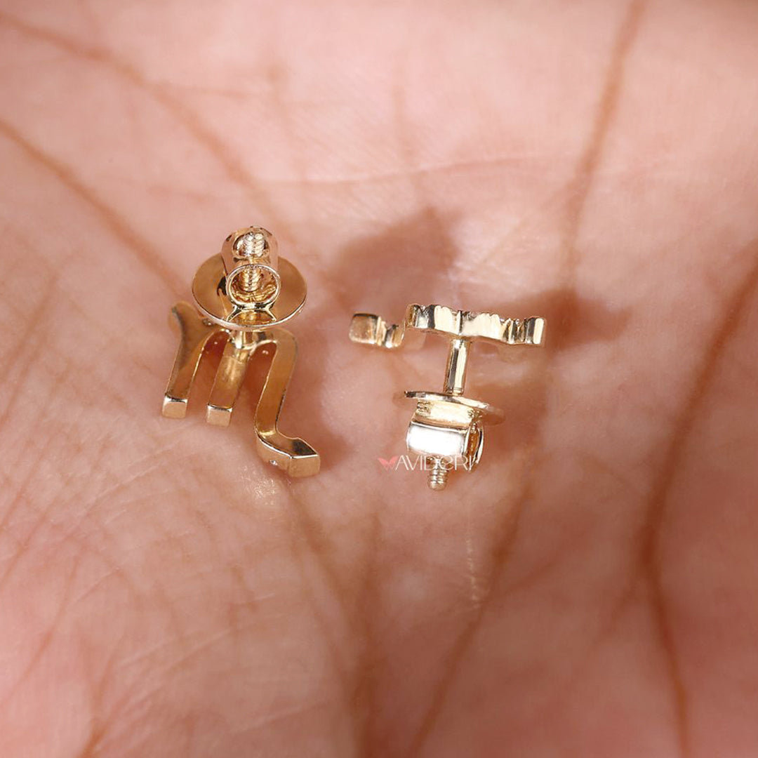 Yellow gold round cut earrings in a sleek stud style

