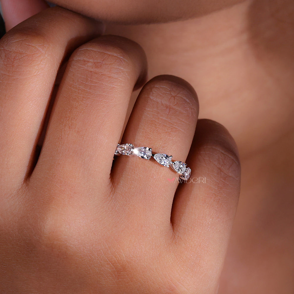 Pear diamond wedding band with unique shape and sparkle.
