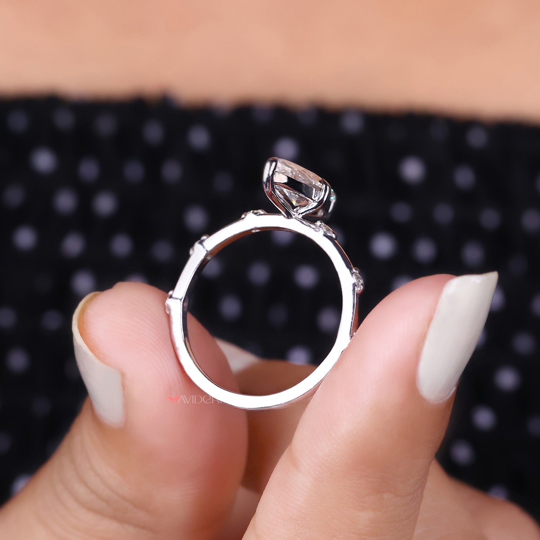 The white gold engagement ring offers a graceful, modern look perfect for proposals.
