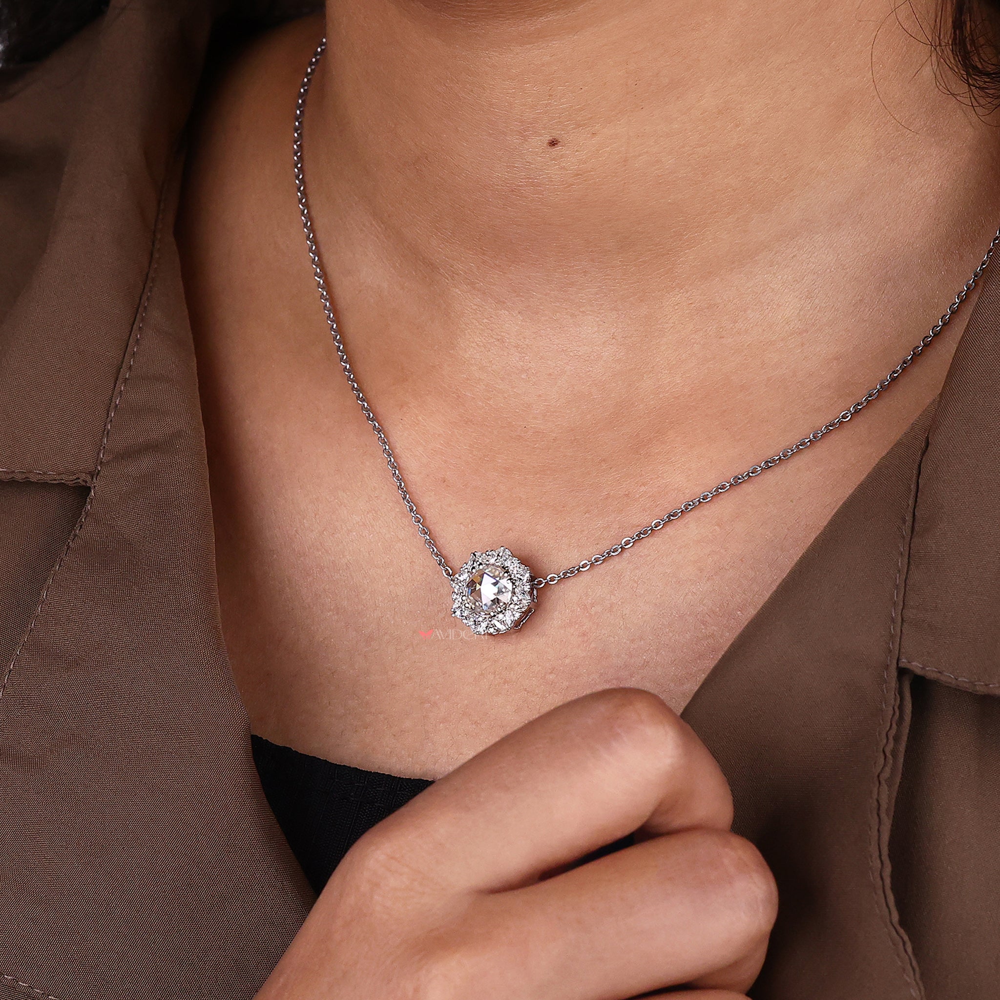 Round and marquise side stone pendant full of bright cuts.