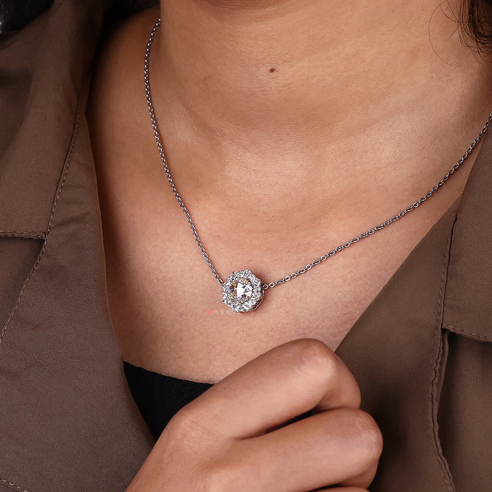 Round and marquise side stone pendant full of bright cuts.