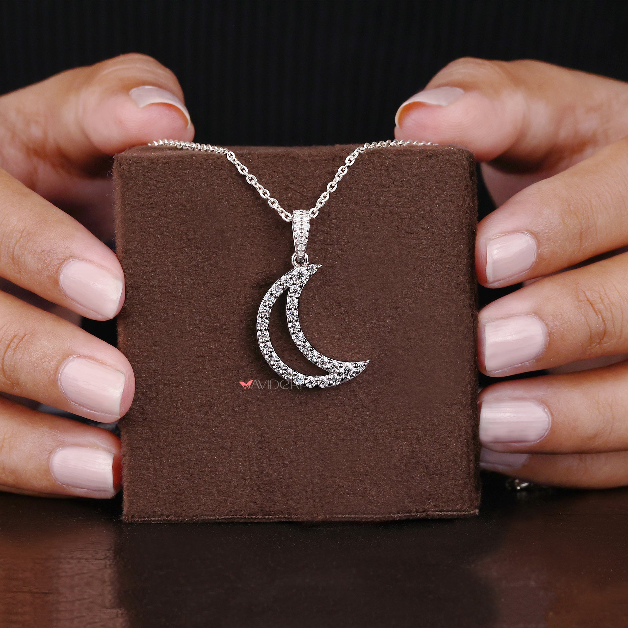Round cut moissanite pendant brings dazzling beauty with every turn.