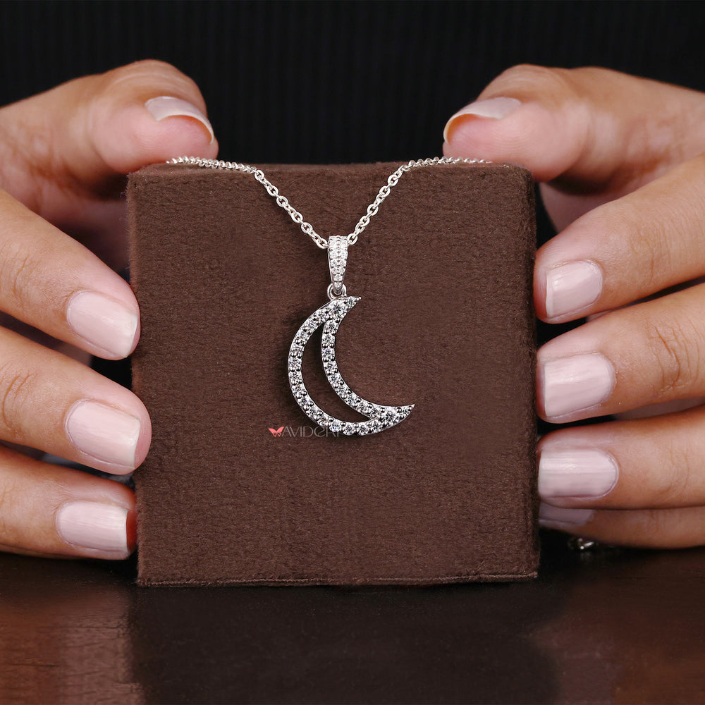 Round cut moissanite pendant brings dazzling beauty with every turn.