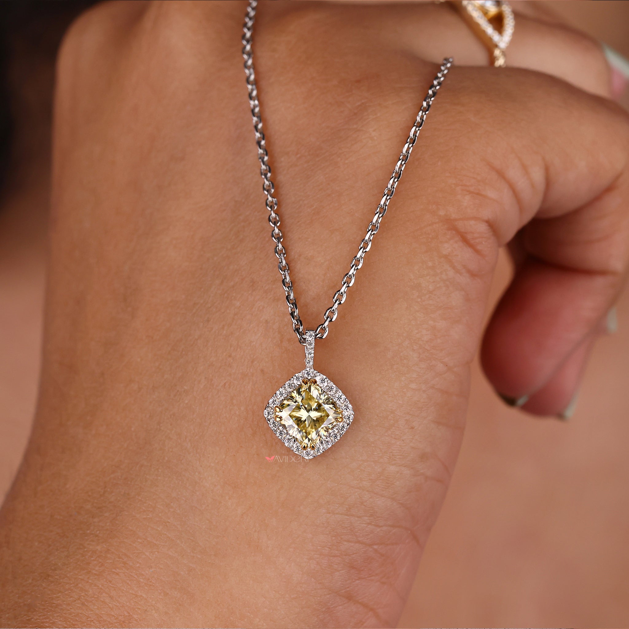 Cushion halo pendant showcasing a stunning sparkle and elegance.
