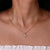 Round Moissanite Pendant, highlighting a brilliant round Moissanite stone in a sleek setting.