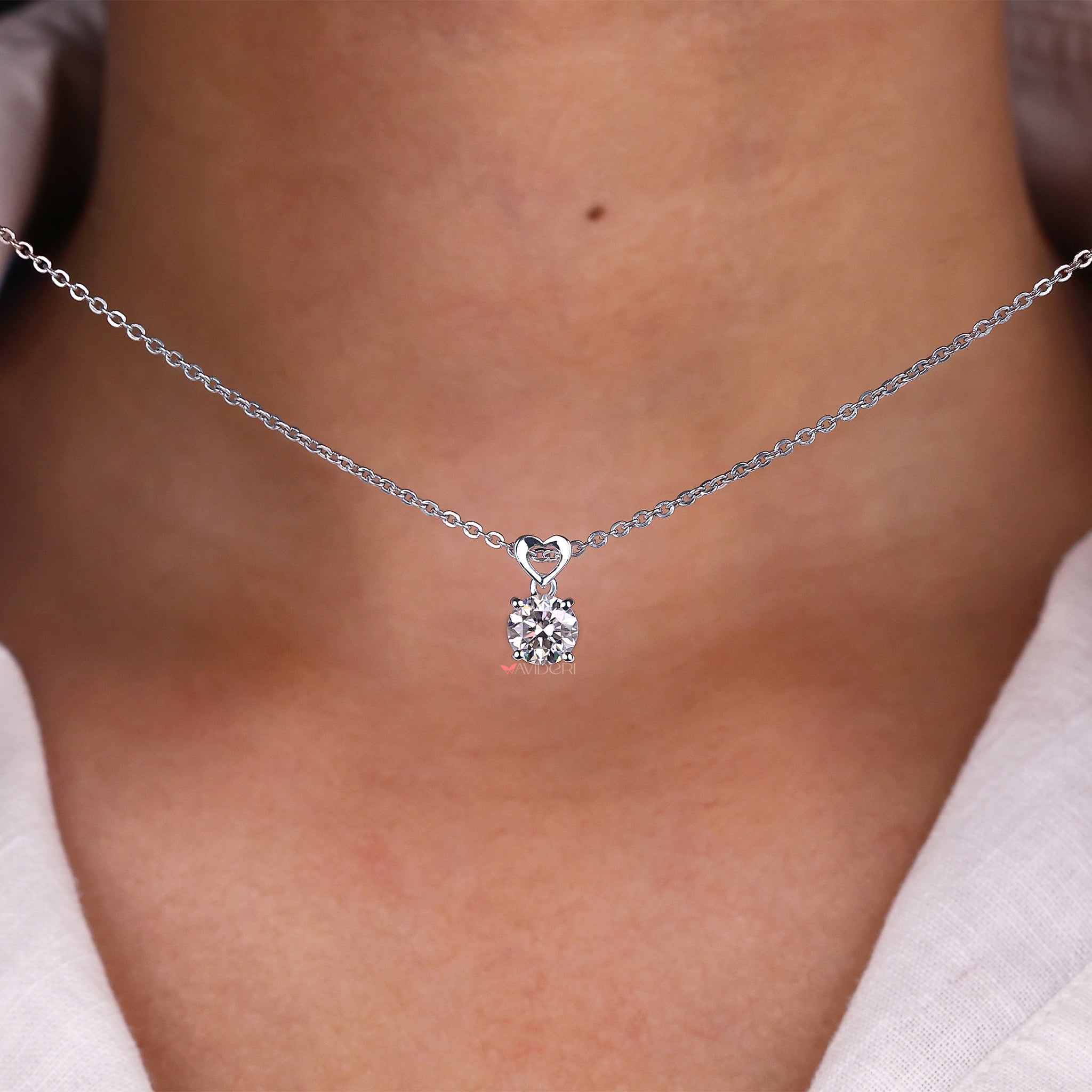 Unique heart-shaped bail pendant with a gorgeous round cut stone for added charm.