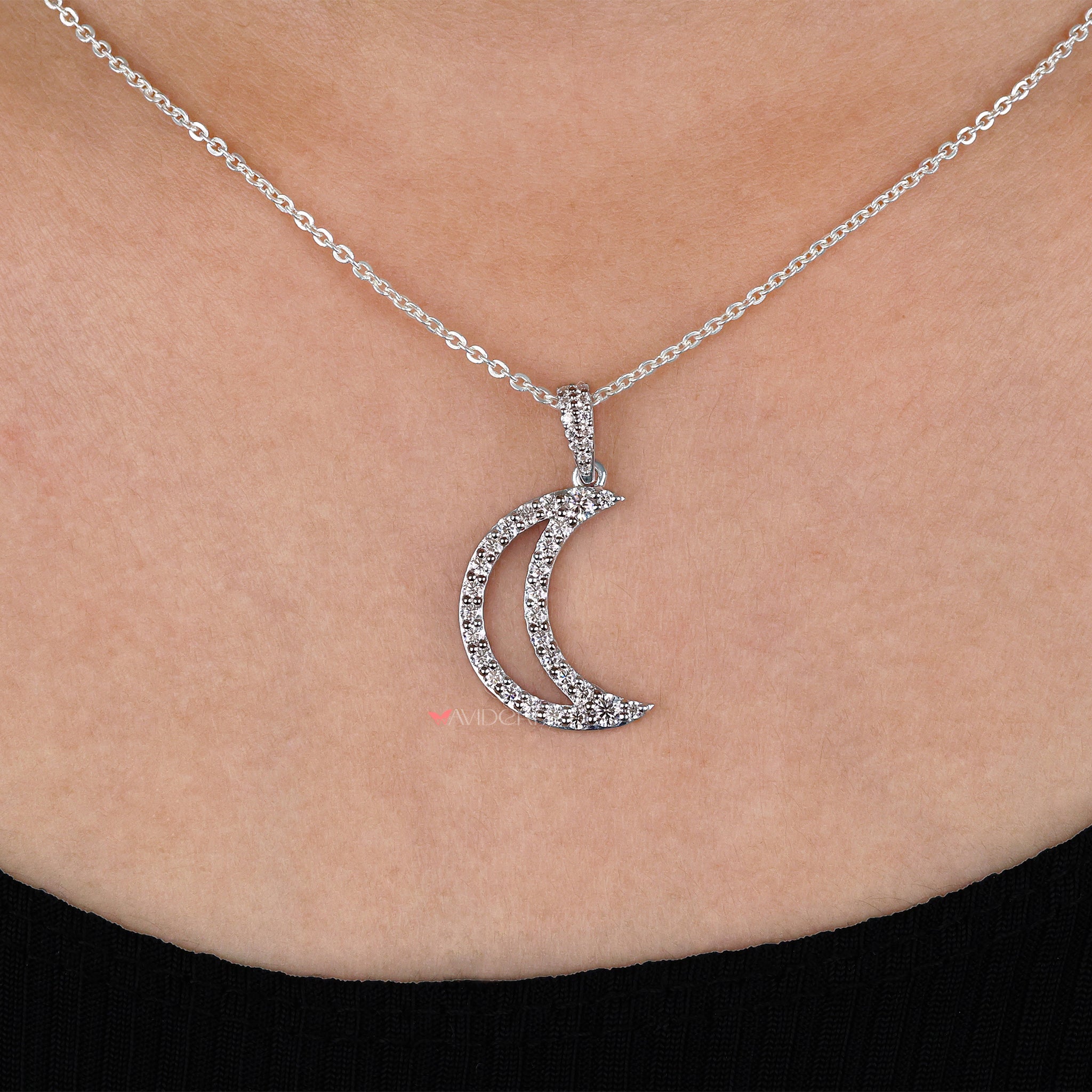 Half moon pendant blends classic design with modern appeal.