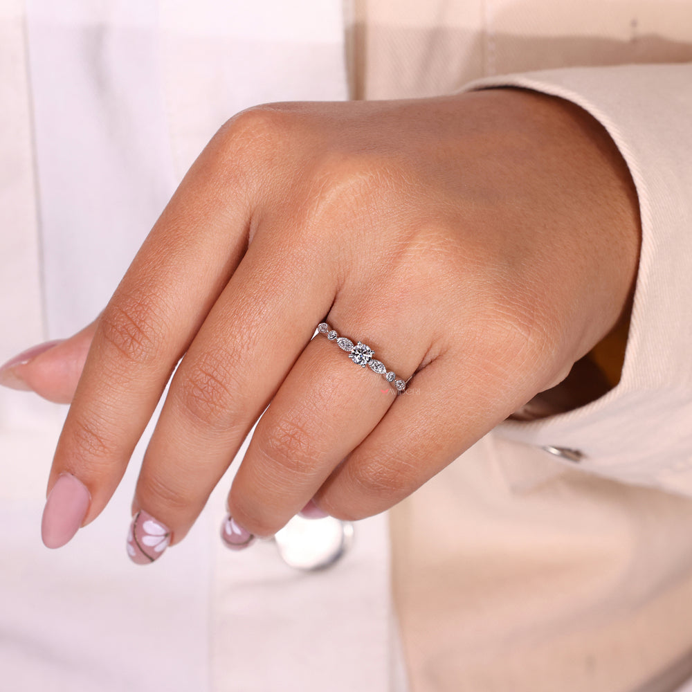 Elegant milgrain engagement ring with intricate detailing and timeless design.
