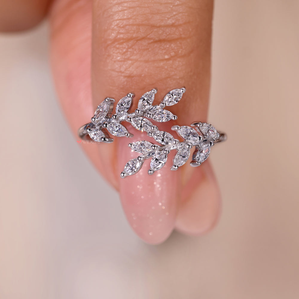 Gold ring leaves design with a marquise diamond centerpiece.
