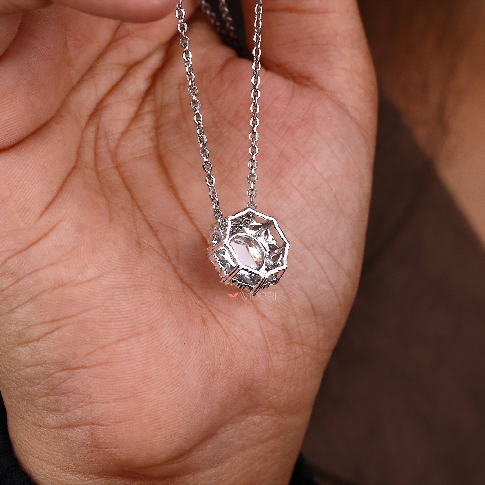 Round and marquise side stone pendant full of bright cuts.