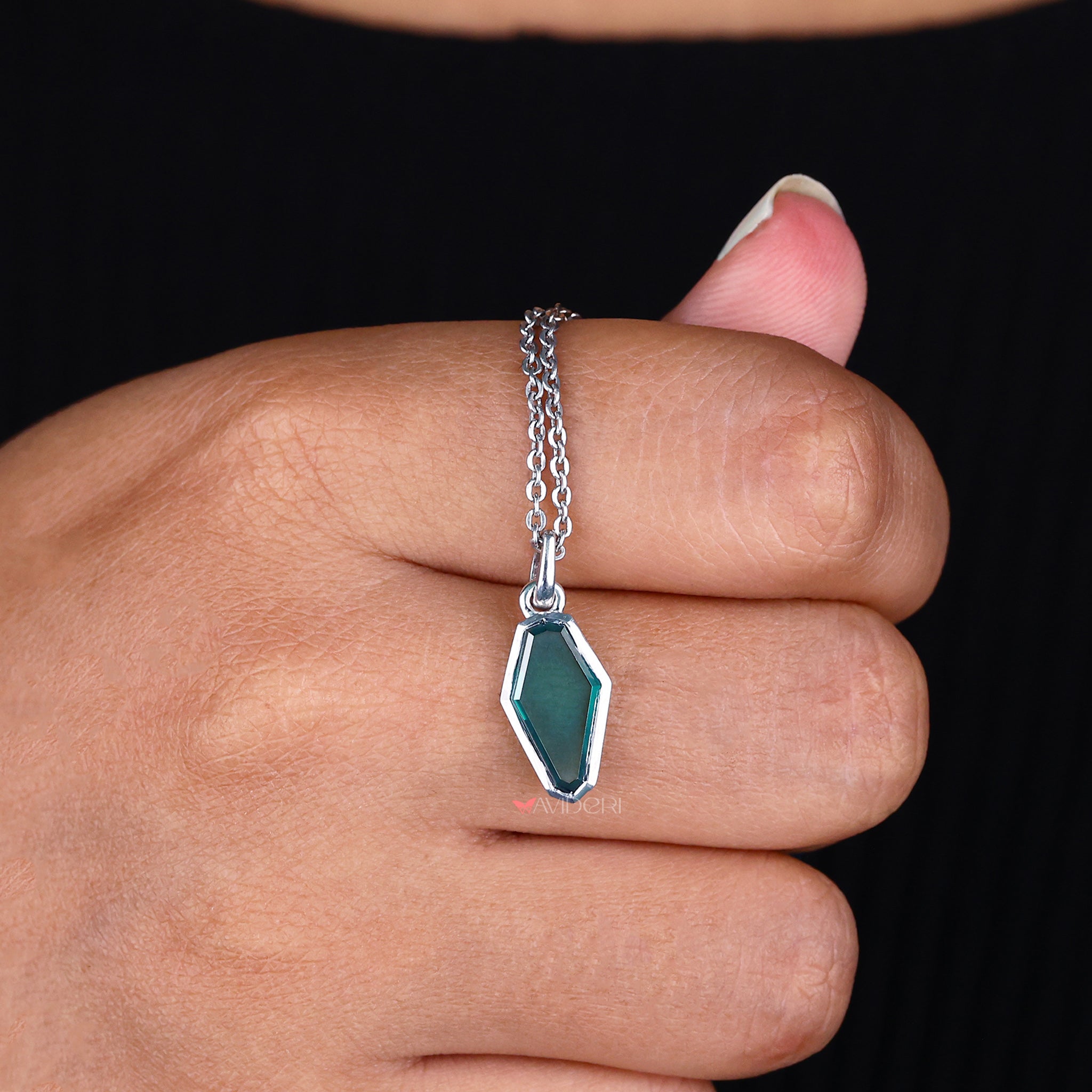Portrait Cut Coffin Bezel Set pendant secures stones while enhancing their beauty.