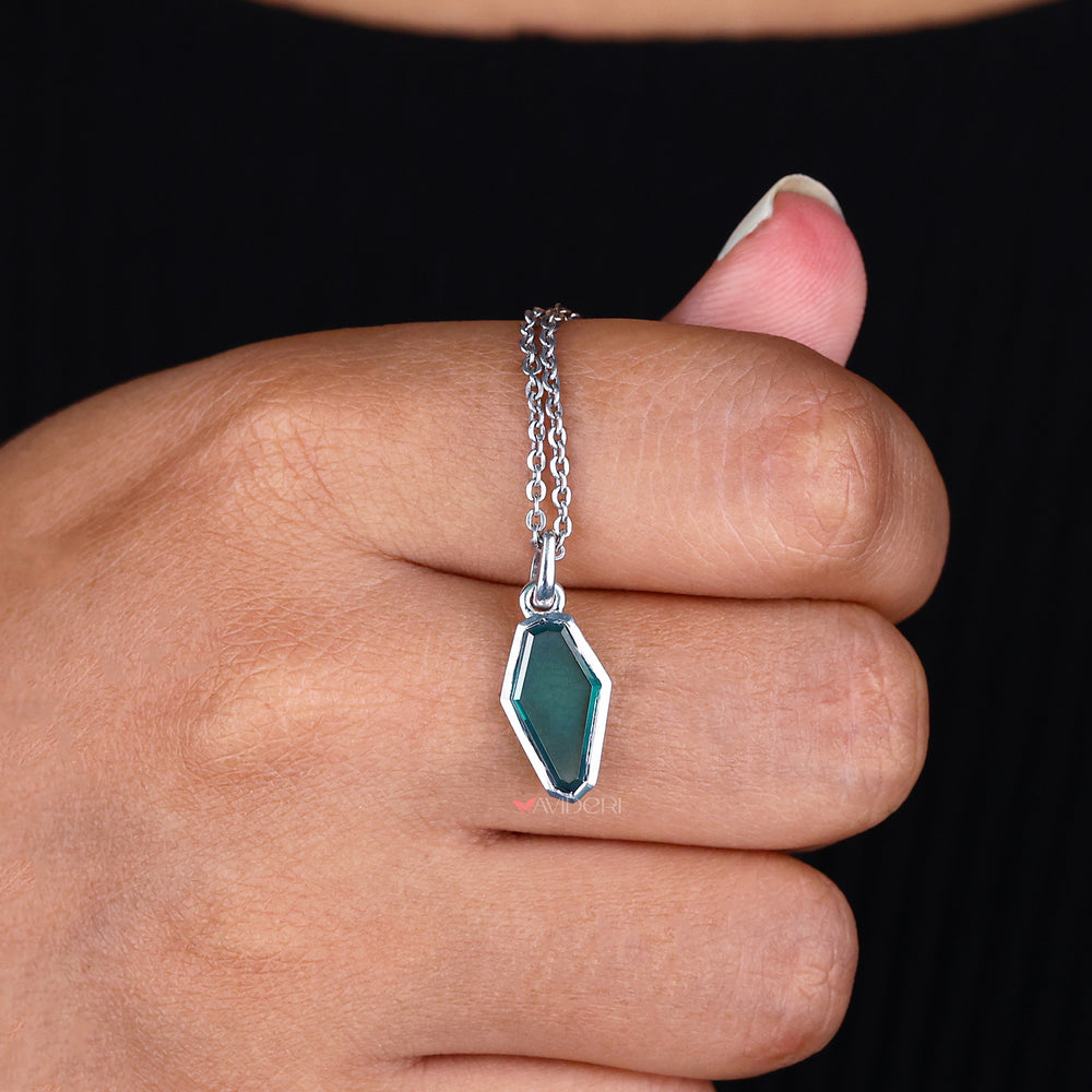 Portrait Cut Coffin Bezel Set pendant secures stones while enhancing their beauty.