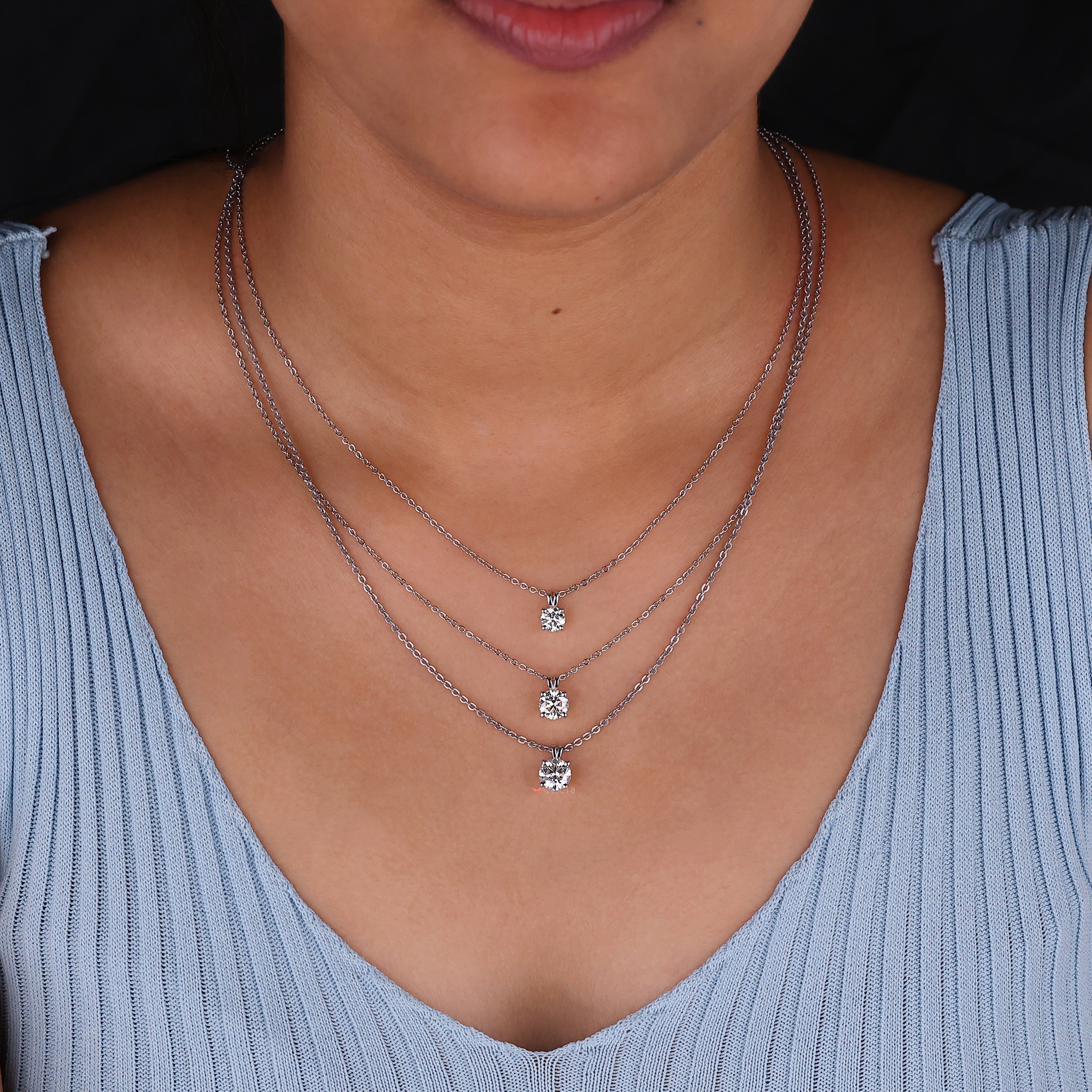 Handmade jewelry piece showcasing a solitaire moissanite pendant for her.