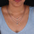 Handmade jewelry piece showcasing a solitaire moissanite pendant for her.